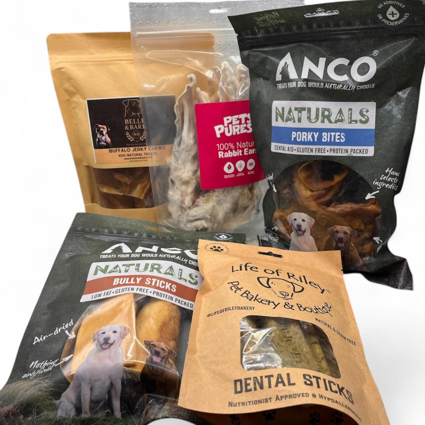 Collection of various dog treat packages on a white background